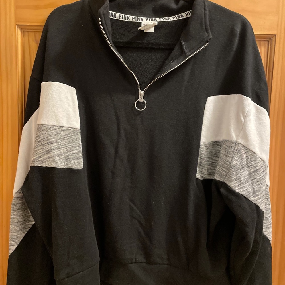 Pink Victoria’s Secret sweatshirt with a zipper